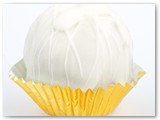 Sweet Sushi Pina Colada Cake Ball- Our pina Colada cake mixed with our pina colada icing, dipped in our premium white chocolate and drizzled with more white chocolate.